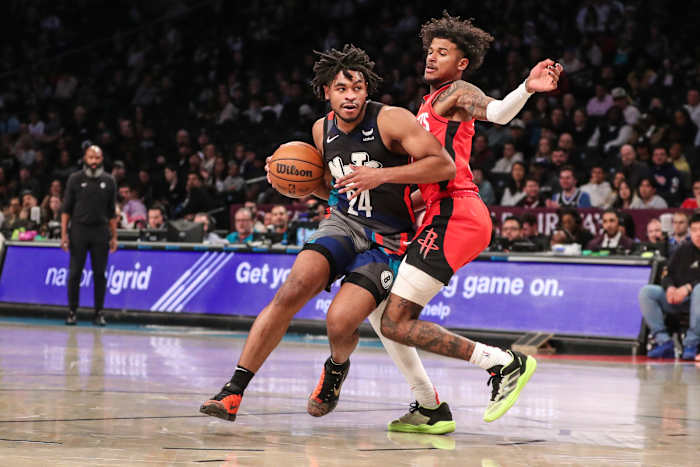 Nets guard Cam Thomas drives past Houston Rockets guard Jalen Green (4) in the second quarter at Barclays Center.